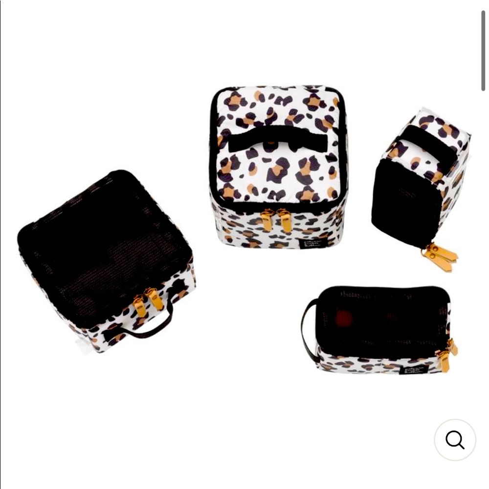 Sold.  Petunia Pickle Bottom packing cubes set of 4 new and unused without tags